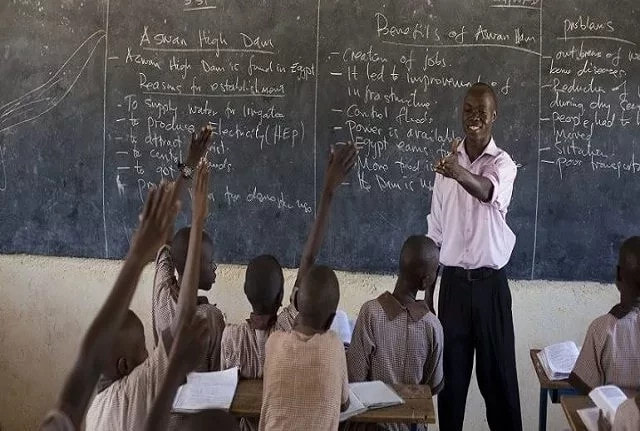 Nigerian teacher with pupils
