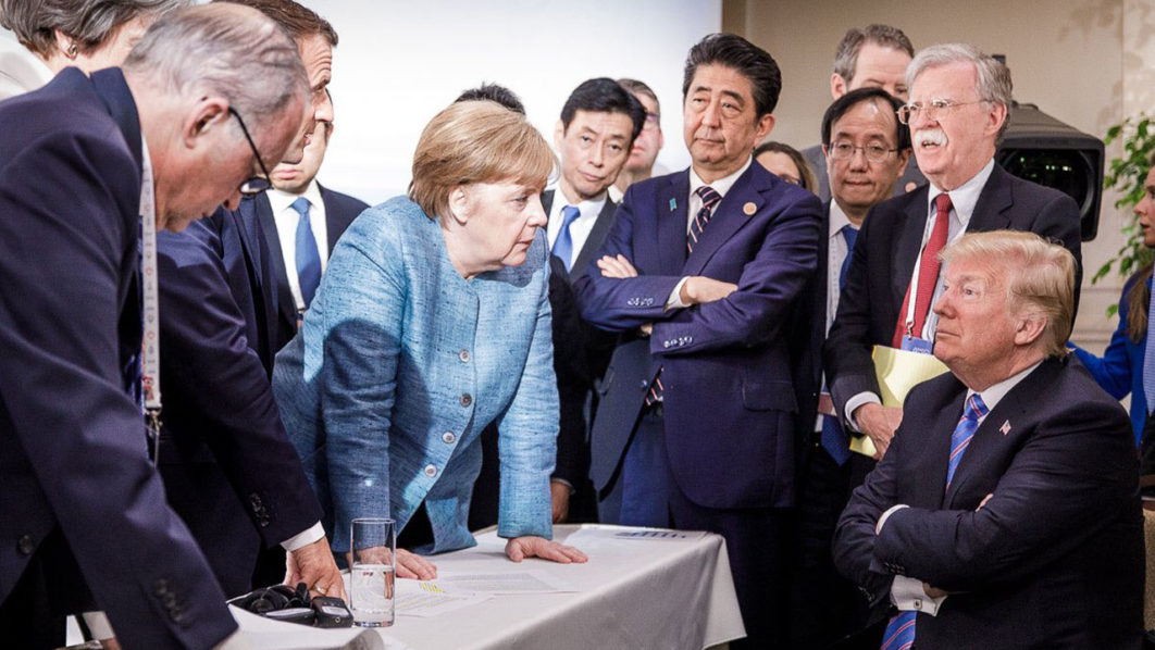 Photo released on Twitter by the German Government's spokesman Steffen Seibert on June 9, 2018 and taken by the German government's photographer Jesco Denzel shows US President Donald Trump (R) talking with German Chancellor Angela Merkel (C) and surrounded by other G7 leaders during a meeting of the G7 Summit in La Malbaie, Quebec, Canada. The photo went viral, popping up all over social media, sometimes in its original form sometimes altered for humorous or satirical ends. / AFP PHOTO / Bundesregierung / Jesco DENZEL /