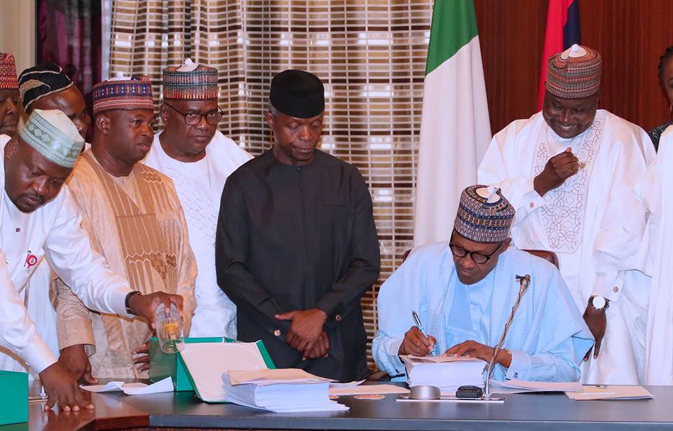 President Muhammadu Buhari signing 2018 Appropriation Bill at the Presidential Villa on Wednesday, June 20, 2018