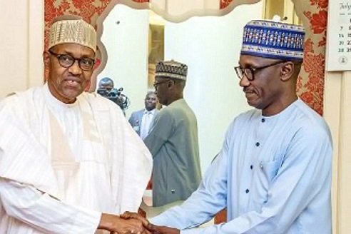 President Muhammadu Buhari shaking hands with GMD NNPC, Mele Kyari