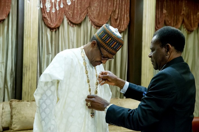 File Photo: Buhari being decorated with the Equatorial Guinea highest national honour