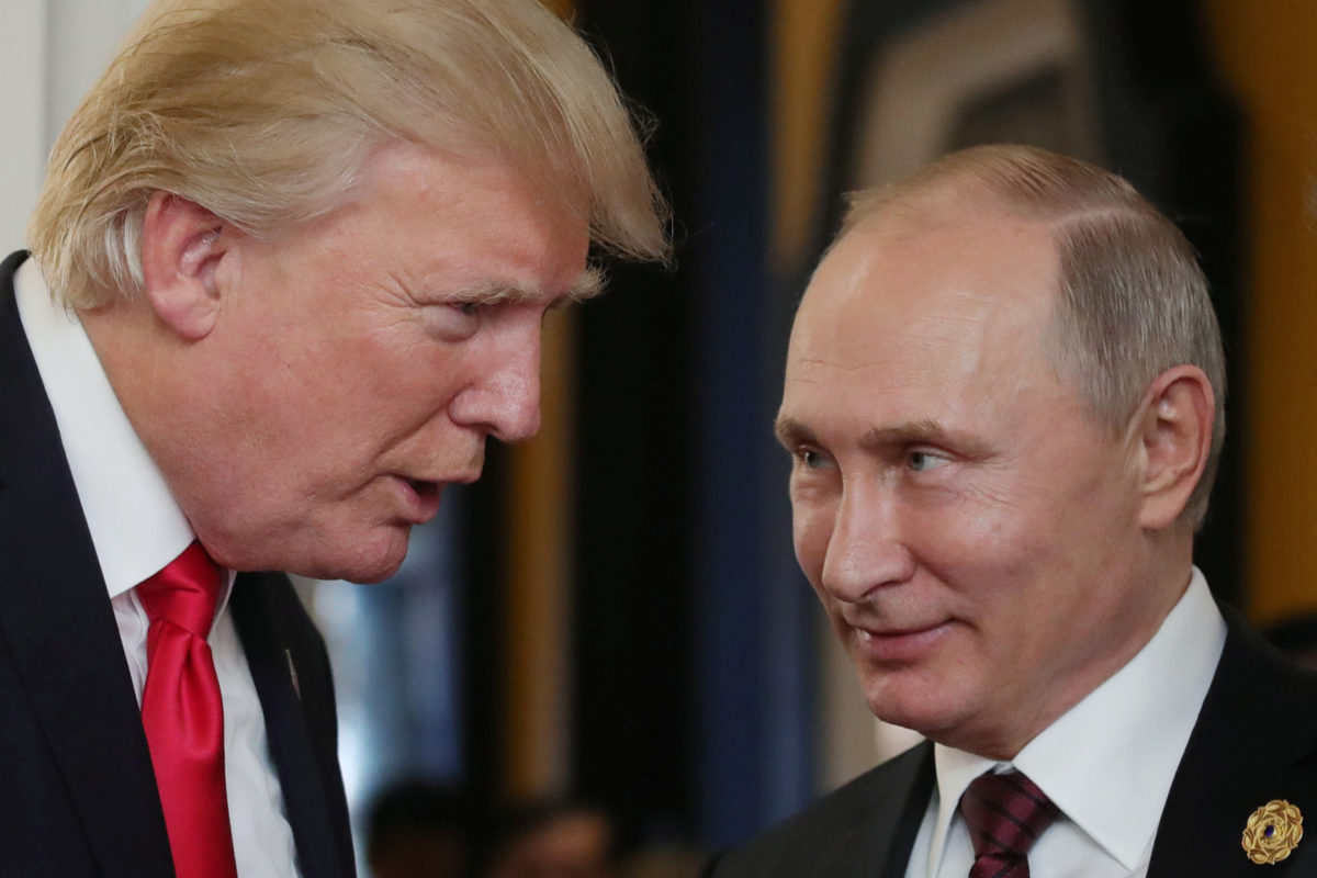 FILE: US President Donald Trump (L) chats with Russia's President Vladimir Putin