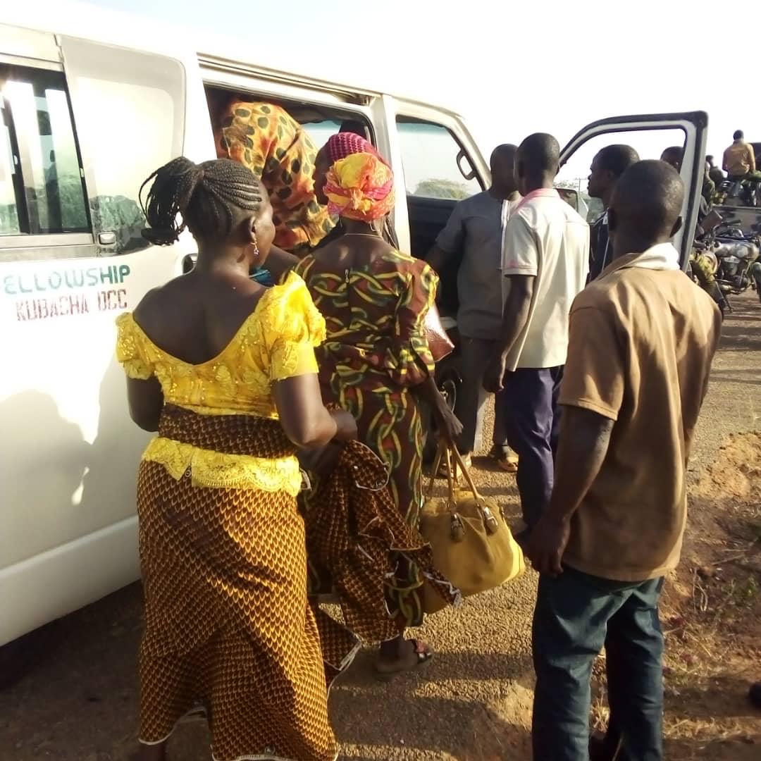 The rescued travelers going into their bus.