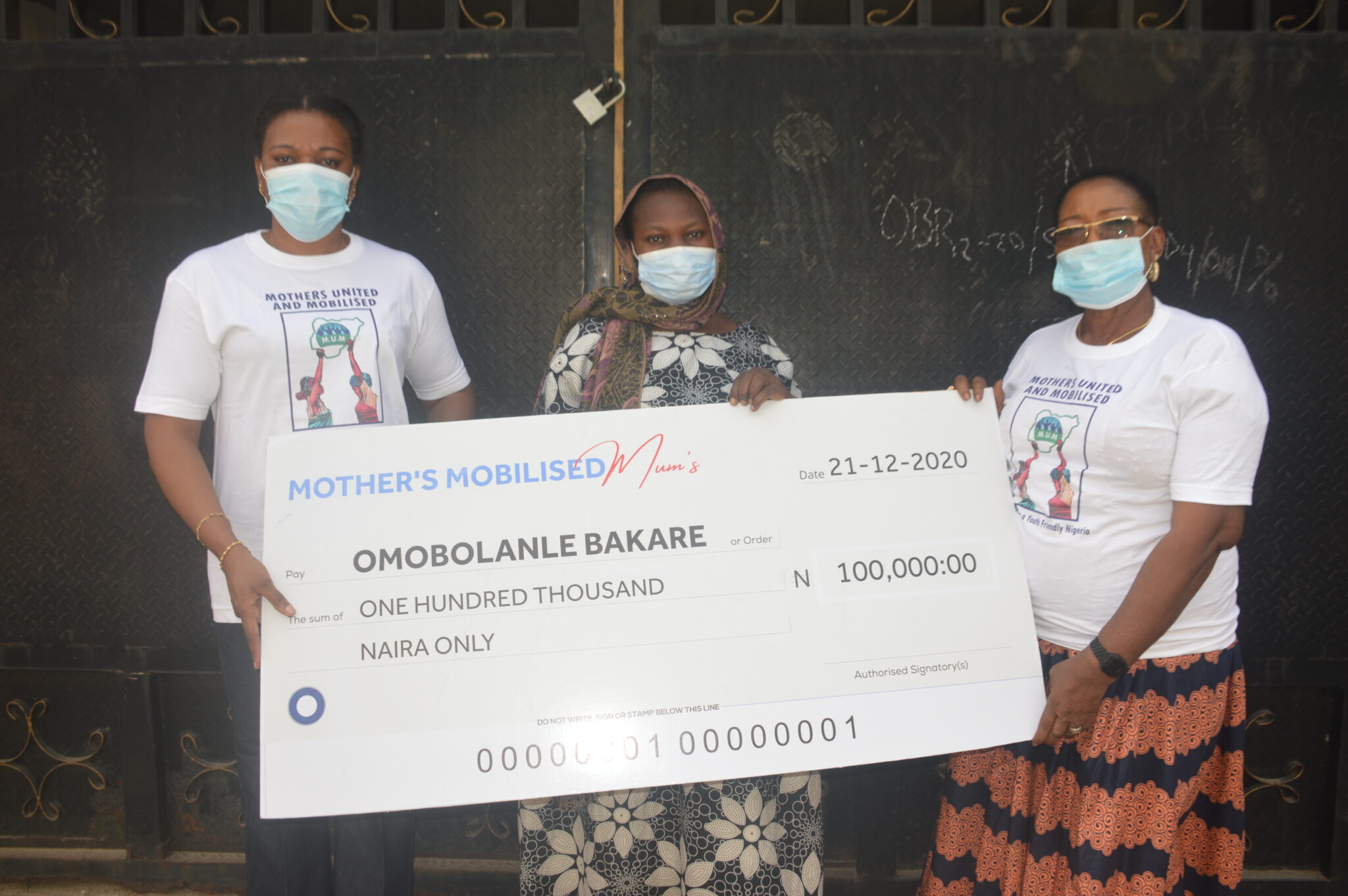 Presenting a cheque to support Omobolanle Bakare, (Middle) whose husband, Kareem Rasheed, was killed by stray bullet during the EndSARS protest in Lagos.