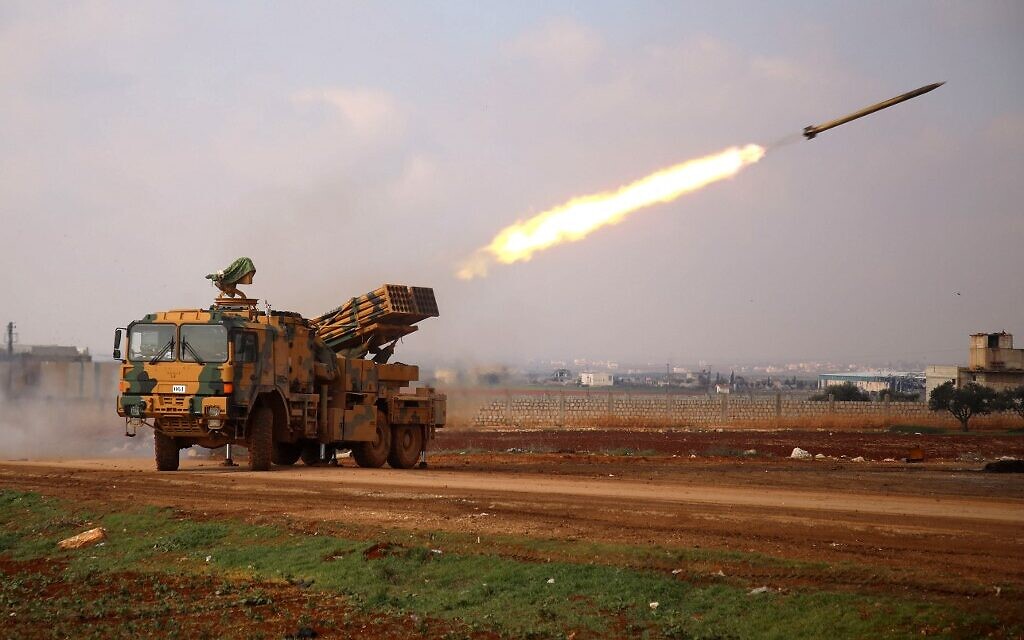 A Turkish military mobile rocket launcher fires from a position near the village of Miznaz, on the western outskirts of Syria's Aleppo province, on February 14, 2020, at Syrian government forces' positions in the countryside of Aleppo province. (Photo by AAREF WATAD / AFP)