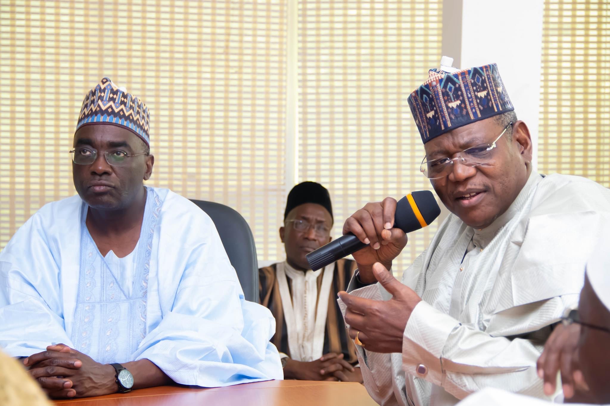 Former Governor of Jigawa State Sule Lamido speaking at the event while Dr Yunusa Dangwani listens.