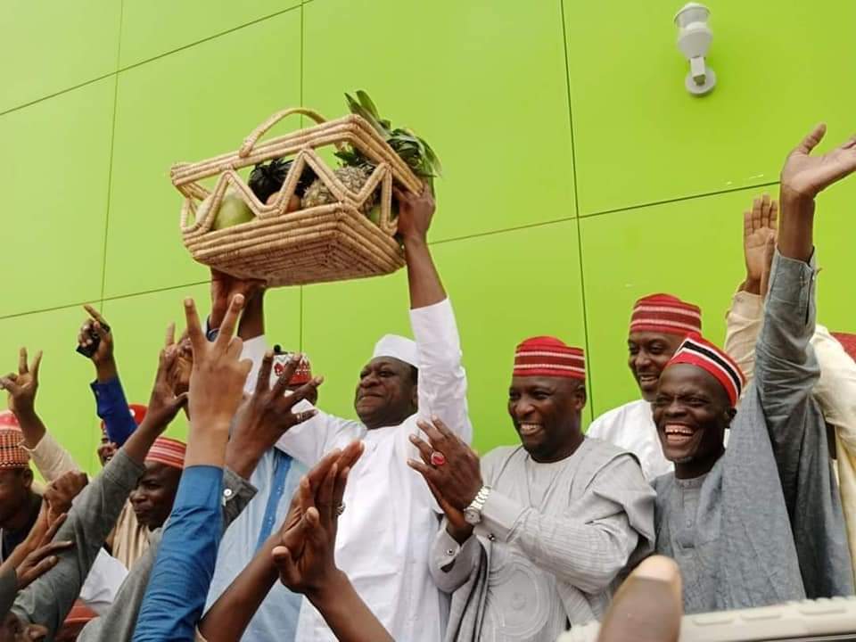 Mr Jibrin is pictured above with the party leaders hoisting a basket of fruits, the party's logo, in acceptance of his entry. 