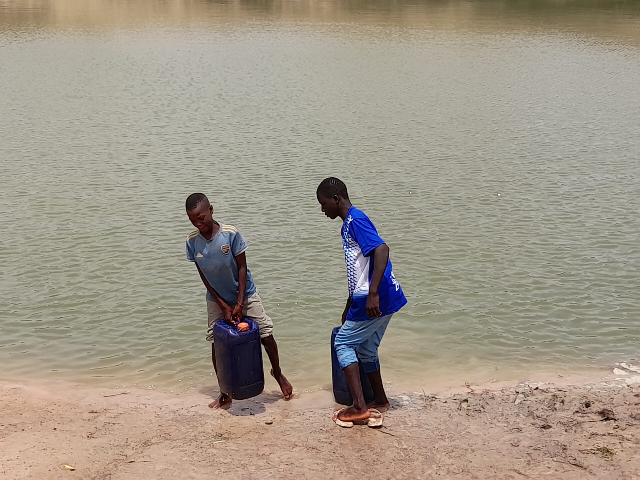 Two out-of-school children fetching water at Kanwa Community Warawa LGA Kano State. Photo: Abdulwaheed Sofiullahi