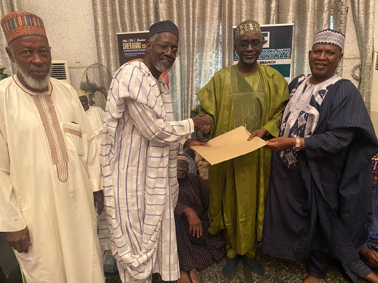 The chairman of the 30 member committee Barr Habibu Adamu (second left) presenting the report of the committee to Senator Ibrahim Shekarau.