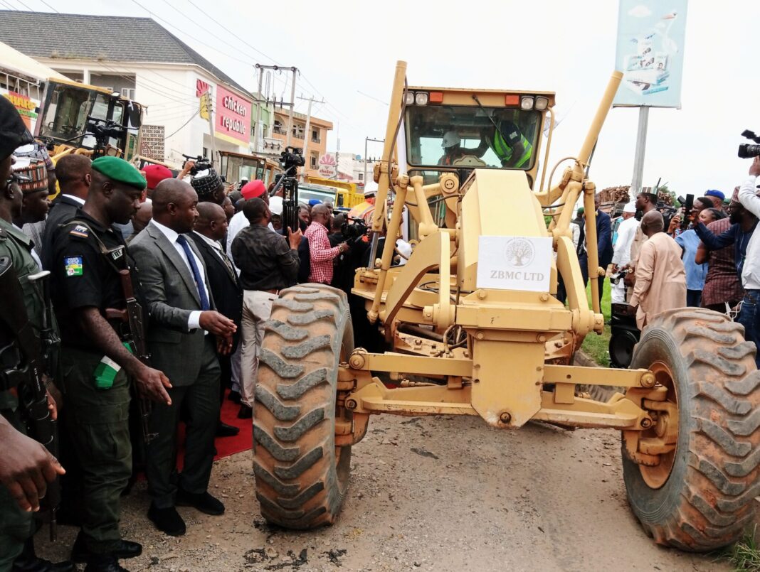 Wike on the wheel of a caterpillar while inaugurating the rehabilitation of 135 roads in Abuja on Monday