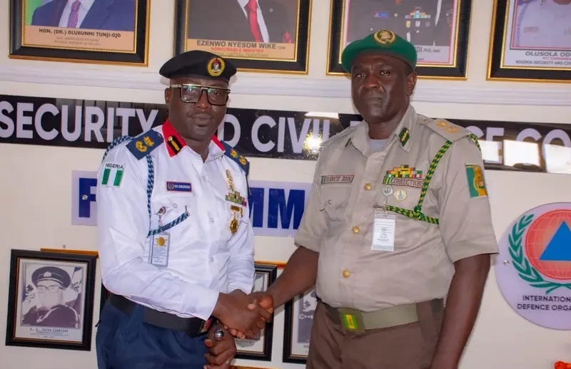 L-R: FCT NSCDC Commandant, Olusola Odumosu and FCT Correctional Service Comptroller, John Francis