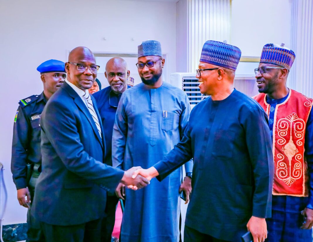 Governor Sule in handshake with Peter Obi