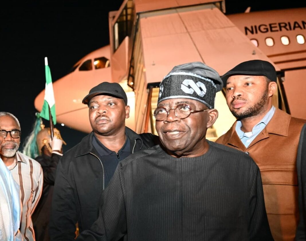 Adegboyega Fasasi (in black) behind President Bola Tinubu on Saturday October 19, 2024