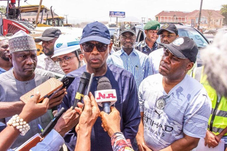 Minister of State for Works, Bello Muhammad Goronyo,fielding questions from newsmen while inspecting ongoing Expansion of Abuja-Keffi expressway on his left is the Permanent Secretary, Federal Ministry of Works, Engr. Olufunsho Adebiyi and the Director, Highways, North Central Zone, Engr. S.K. Ahmed (r.).