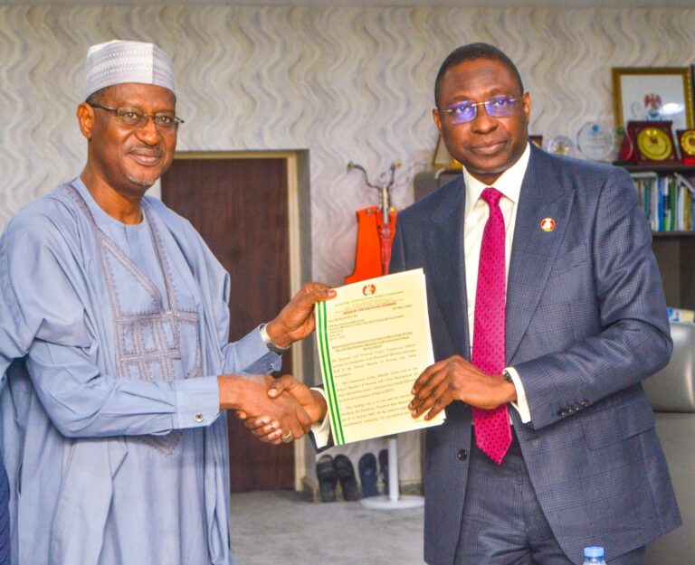 From left:Minister of Housing and Urban Development Ahmed Dangiwa and the Executive Chairman of EFCC, Olanipekun Olukoyede .